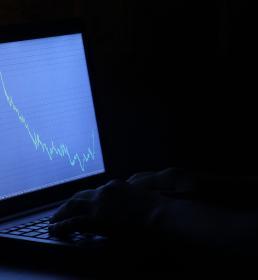 Studying a stock market graph on a screen